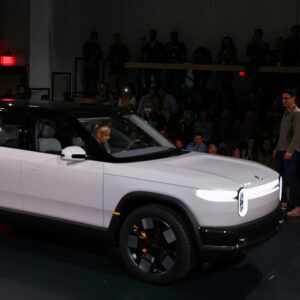 Read more about the article Uber to Buy Rivian Vehicles for Use as Driverless Taxis