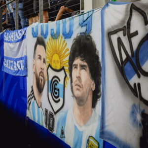 Read more about the article As Messi Dominates the World Cup, a War Is Waged Over Maradona’s Image